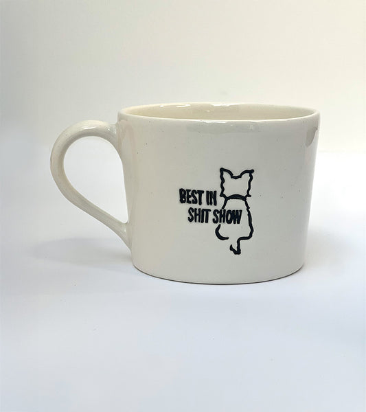 White mug with black 'Best in shit show' text and graphic on a white background