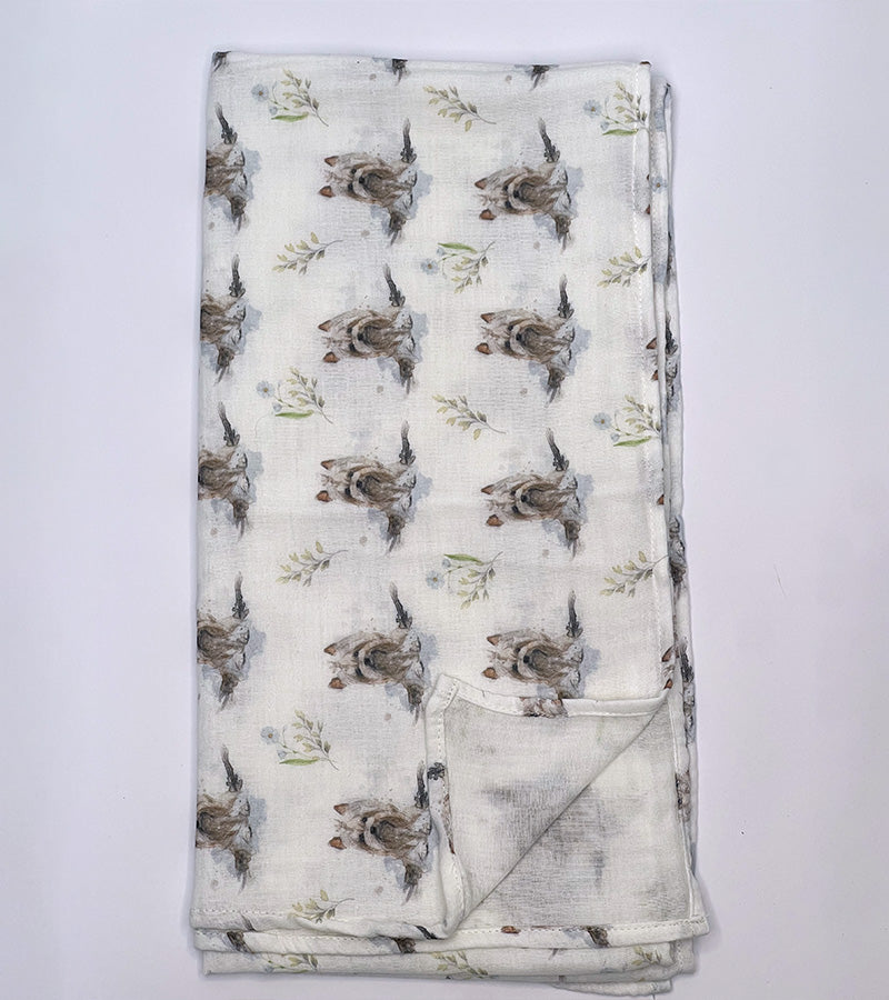 Folded scarf with Yorkie dog pattern on a white background