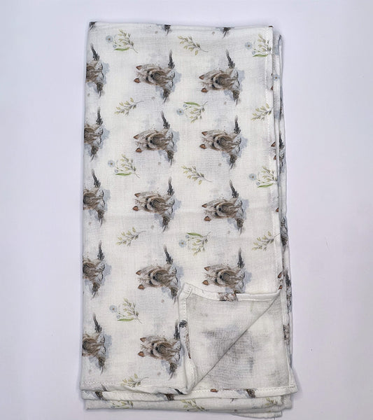 Folded scarf with Yorkie dog pattern on a white background