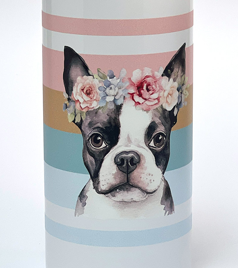 Tumbler with a design of a Boston Terrier dog wearing a floral crown on a striped background