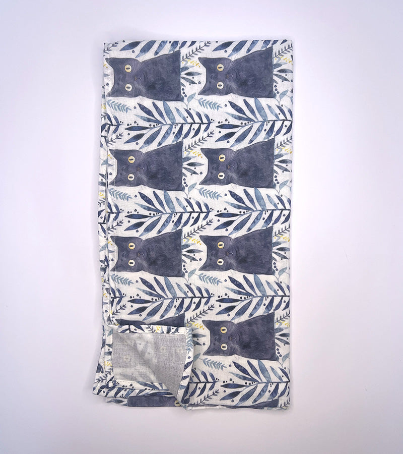 Scarf fabric with black cat pattern on a white background