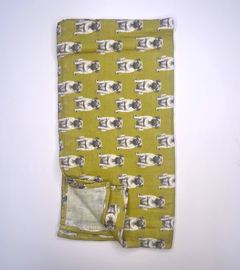 Green scarf fabric with pug dog pattern on a white background