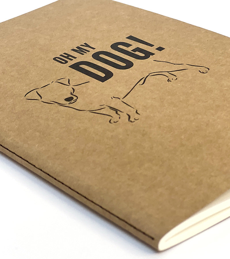 Brown paper notebook with a dog illustration and 'Oh my DOG!' text on a white background