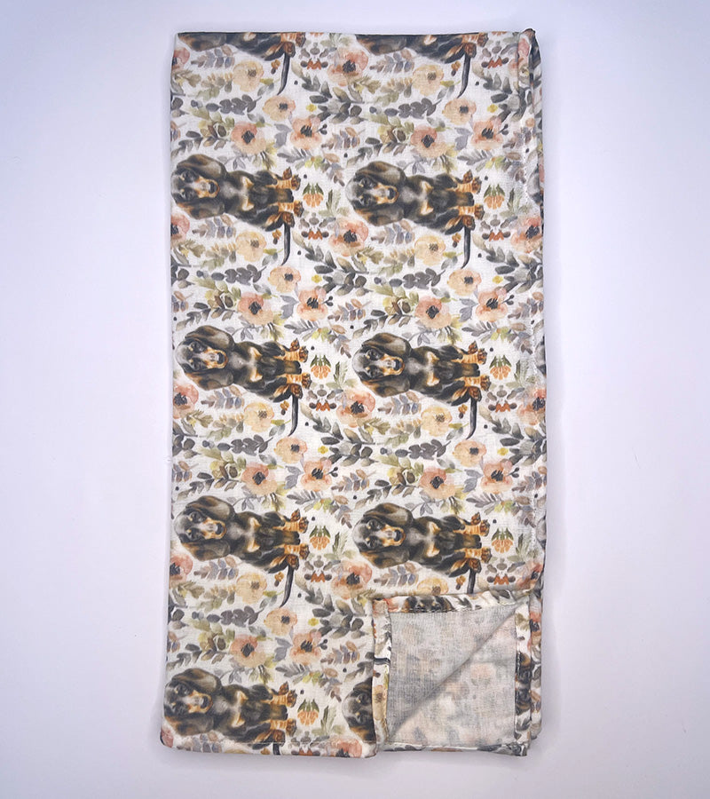 Floral patterned and dachshund dog fabric with a white background