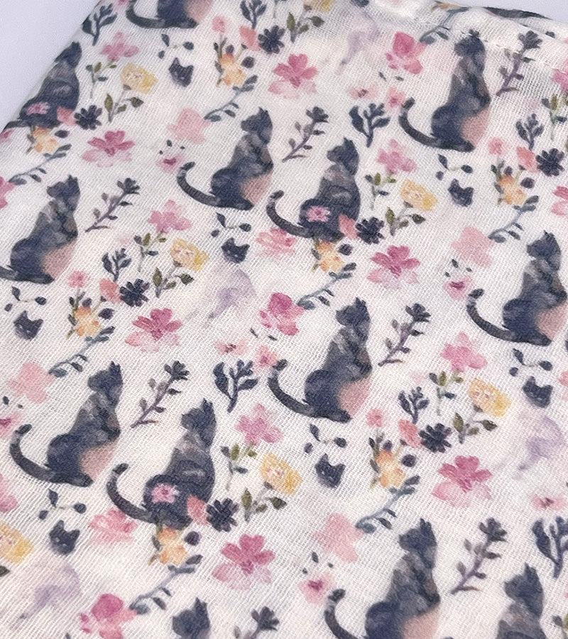 Scarf fabric with black cat and floral pattern on a white background