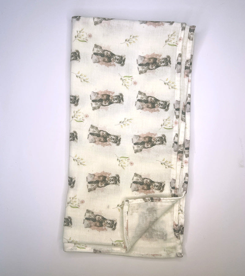 Folded fabric with dog pattern on a white background