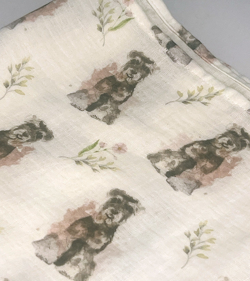 Fabric with dog pattern and floral elements on a neutral background