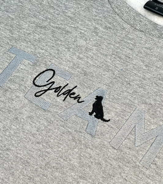 Gray sweatshirt with 'Golden' text and Golden Retriever dog silhouette logo