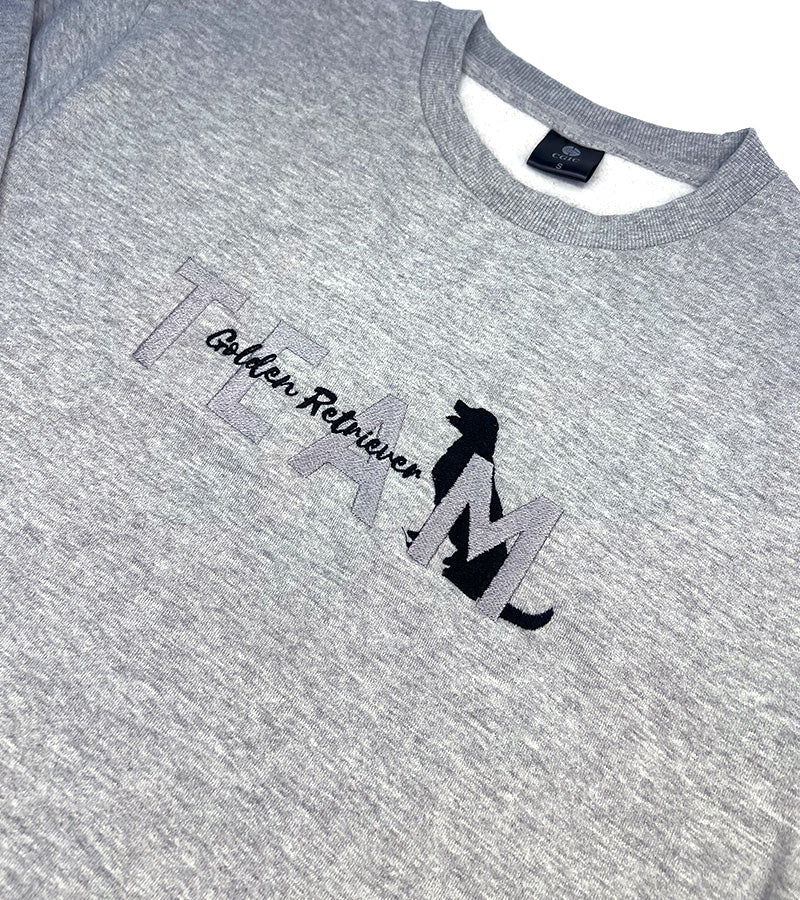 Gray sweatshirt with 'TEAM Golden Retriever' text and dog silhouette image on a plain background