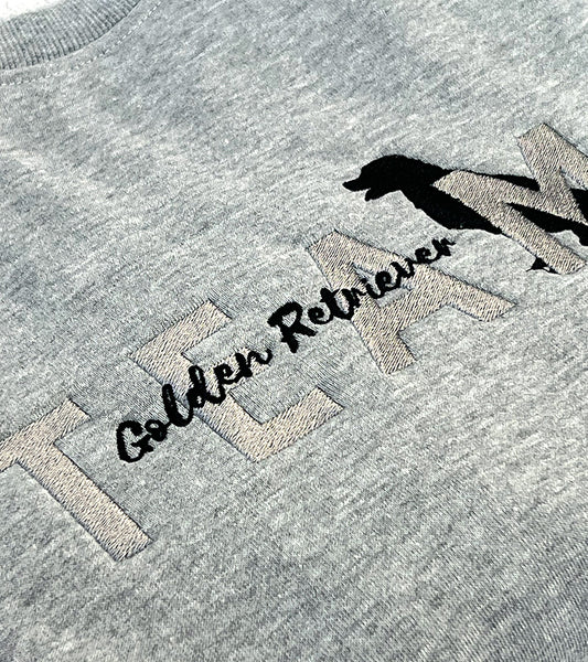 Gray sweatshirt with 'TEAM Golden Retriever' text and dog silhouette image on a plain background
