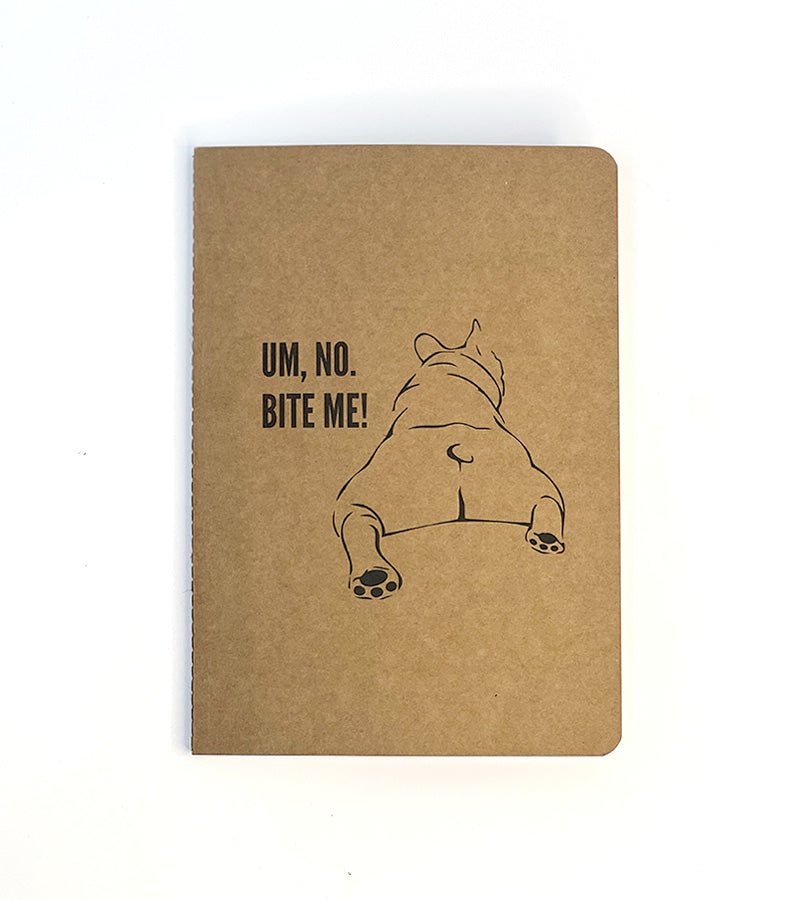Brown notebook with 'Um, no. BITE ME!' text and a dog illustration on a white background