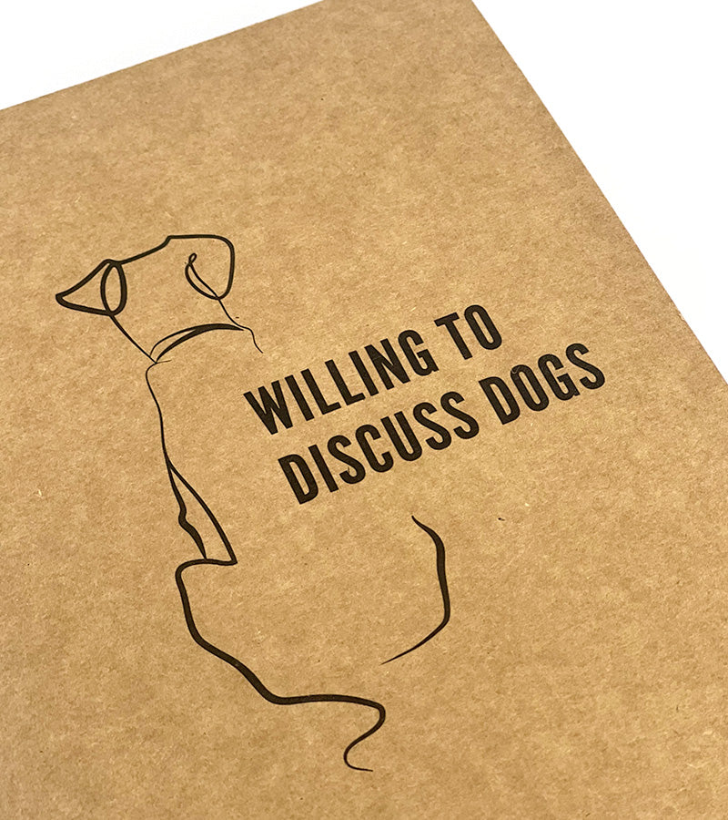 Kraft paper notebook with a dog illustration and 'Willing to Discuss Dogs' text on a white background