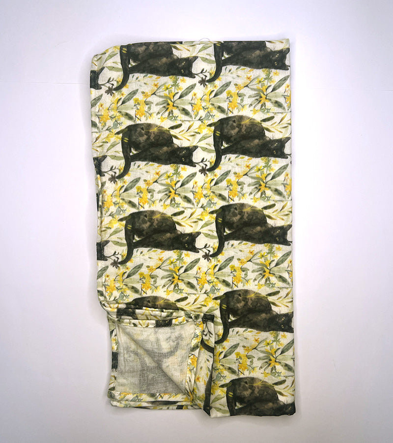 Scarf with black cat and yellow floral pattern on a white background